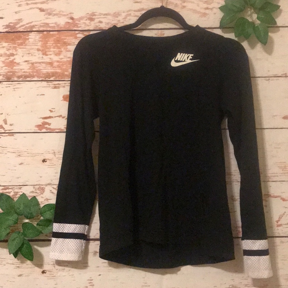 A black shirt with white stripes on the sleeves.